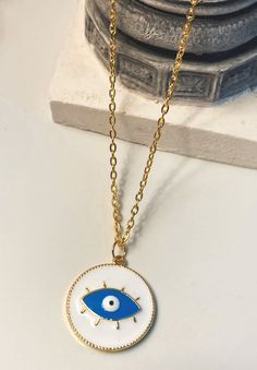 White evil eye necklace, round-shaped, stainless steel gold colour. Charm necklace for summer:) Trendy Gold Circular Necklace, Trendy Gold Circle Necklace, Trendy Gold Plated Round Necklace, Gold Circle Stainless Steel Necklace, White Gold Plated Round Charm Necklace, White Round Gold Plated Charm Necklace, White Round Pendant Necklace In Stainless Steel, White Stainless Steel Necklace With Round Pendant, White Evil Eye Round Pendant Necklace