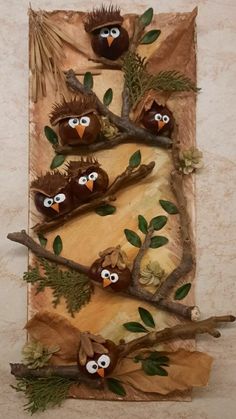 three owls are sitting on branches with leaves and twigs around them, in the shape of a rectangle