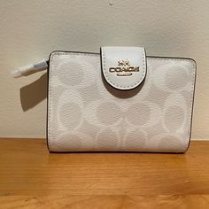 This Coach Medium Corner Zip Wallet In Signature Canvas Is Brand New With Tags. It Originally Retails For $198! The Wallet Is Made Of Signature Coated Canvas And Smooth Leather, Has Seven Credit Card Slots, A Bill Compartment, Id Window, Snap Closure And A Zip Coin Pocket. It Measures 5" (L) X 3 1/2" (H) X 1/2" (W) And The Style Number Is C0082. Window Snap, Coach Lights, Soft Green Color, Book Clutch, Checkbook Wallet, Envelope Wallet, Signature Canvas, Mini Wallet, Gingham Print