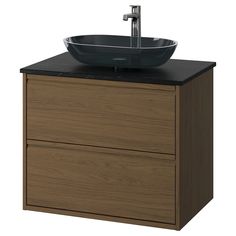 a bathroom vanity with a black bowl sink