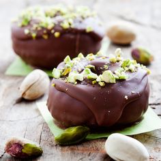 two pieces of chocolate with nuts and pistachio