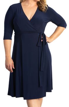 There's a reason a classic wrap dress is a closet staple: the becoming shape and timeless look make it endlessly wearable. This version is cut from nicely fluid fabric and sculpted with pretty front and back princess seams. 44" length (size 2X) True wrap style with side tie closure Surplice V-neck Three-quarter sleeves Unlined 95% polyester, 5% spandex Made in the USA of imported fabric Dresses Black Blazer Style, Dresses For Apple Shape, Plus Size Looks, Balloon Sleeve Dress, Princess Seams, Stylish Plus, Classic Wedding, Knee Length Skirt, Nordstrom Dresses