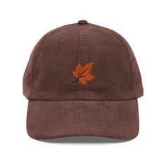 The perfect hat for someone that loves Fall & Autumn (or as a gift for yourself!). Handmade & stitched in the USA. As part of our commitment to sustainability, each cap is made-to-order. Our cap features a fall leaf embroidered onto it, handmade from scratch. No mass-produced patches! It pairs perfectly with our vintage corduroy dad cap that is oozing with retro style & charm. It is a classic, high-quality piece that will last you for years & years to come. Plus it is soft & comfy to wear! It fits all head sizes and is unisex, featuring an adjustable golden buckle. Whether you purchase our caps as a gift for him, or a gift for her, they will love wearing this cap. * Sustainably made-to-order. * Made from 100% cotton corduroy to make it extra soft. * Cotton twill sweatband & taping. * Adjus Fall Cotton Hat With Curved Brim, Brown Adjustable Baseball Cap For Fall, Adjustable Brown Baseball Cap For Fall, Cotton Hat With Curved Brim For Fall, Curved Brim Cotton Hat For Fall, Brown Cap For Everyday Wear, Brown Cap For Everyday, Everyday Fall Baseball Cap, Adjustable Fall Baseball Cap