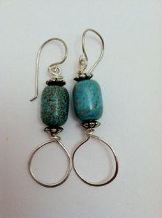 "These earrings consist of a turquoise howlite stone, silver non tarnish wire and silver tone spacer beads.  They are lightweight and are just under 2\" in length.  The earwires are handmade sterling silver." Nickel-free Turquoise Silver-plated Wire Jewelry, Nickel-free Turquoise Silver-plated Jewelry, Nickel-free Turquoise Jewelry In Silver-plated Wire, Turquoise Sterling Silver Nickel-free Hoop Earrings, Turquoise Sterling Silver Hoop Earrings, Artisan Nickel-free Turquoise Hoop Earrings, Handmade Turquoise Sterling Silver Hoop Earrings, Sterling Silver Turquoise Hoop Earrings, Blue Sterling Silver Wire Wrapped Hoop Earrings