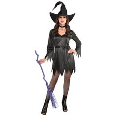 a woman dressed in a witch costume