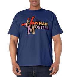 a man wearing a blue t - shirt with the words hannah montana in front of him