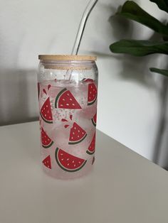 a glass jar with watermelon slices on it