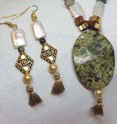 "Handmade Jewelry Designs by WEEDs is handmade and created using high-quality materials designed to last. One Of A Kind Jewelry Pieces and more! Jewelry hypoallergenic nickel free earrings gifts for her! Be right in with the latest trend with these fashionable tassel dangle earrings made with Mother of Pearl and Jade stones. Stones and shells are all natural with their imperfections intact, but that does in now way deter from the beauty of these pieces. They will go well with many assembles and Elegant Handmade Adjustable Tassel Earrings, Casual Dangling Beads Jewelry As Gift, Adjustable Dangle Tassel Earrings As Gift, Handmade Teardrop Tassel Earrings For Gift, Tasseled Drop Earrings As Gift, Adjustable Handmade Gold Tassel Earrings, Adjustable Tassel Drop Earrings, Artisan Gold Jewelry With Tassels, Artisan Gold Tassel Earrings