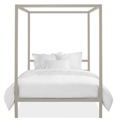 a bed with white sheets and pillows on it's headboard, in front of a white background