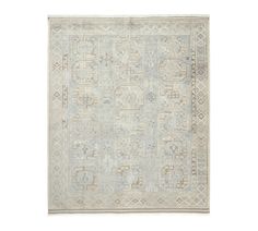 an antique rug with many different patterns and colors on the carpet, including blue, beige and