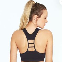 Textured But Seamless, This Low-Impact Sports Bra With Removable Cup Pads Will Give You The Flexibility You Need In Your Yoga Session, As Well As Stylish Ribbed Trim And A Ladder-Cutout Racerback! 93% Polyester/7% Nylon 1 1/4" Wide Underband Weave In Pattern Low Impact Scoopneck With Strap Detail At Racerback Removable Cup Pads, Non-Adjustable Straps Dry-Wik Moisture Performance Machine Wash Athleisure T-back Sports Bra With Seamless Construction, Seamless T-back Activewear For Workout, Sporty Black Sports Bra With Built-in Bra, Seamless Stretch T-back Sports Bra, Seamless Stretch T-back Activewear, Sporty T-back Crop Top For Workout, Casual Black T-back Activewear, Black Sports Bra With Built-in Bra And Medium Support, Black Compression Tank Top With Built-in Bra