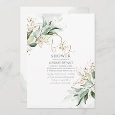 a white and gold floral baby shower with greenery on the bottom, in watercolor