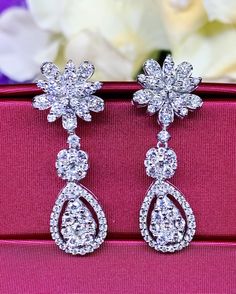 HANDCRAFTED TO PERFECTION! SPECIAL AND LOVELY FLORAL DESIGN, ILLUSION SETTING (APPEARS TO BE LIKE A 0.5 CARAT BRILLIANT PEAR Diamonds). With over 128 pieces of UNTREATED AND GENUINE F/VS QUALITY SPARKLING DIAMONDS! Perfect for every event! SET IN 18K SOLID WHITE GOLD HANDCRAFTED, DANGLING EARRINGS! SUGGESTED RETAIL VALUE: $8,800 DIAMONDS: 128 ROUND BRILLIANT, FULL CUT with excellent firing diamonds, weighting at 2.16 carats. ALL NATURAL, UNTREATED DIAMONDS. ALL DIAMONDS HAVE NO VISIBLE INCLUSION Brilliant Cut Drop Bridal Earrings For Party, Brilliant Cut Bridal Drop Earrings For Party, Pear-shaped Diamond Chandelier Earrings For Wedding, Brilliant Cut Drop Chandelier Earrings For Anniversary, Wedding Fine Jewelry Diamond Cut Chandelier Earrings, Wedding Fine Jewelry Chandelier Earrings With Diamond Cut, Brilliant Cut Chandelier Earrings For Wedding, Brilliant Cut Dangle Chandelier Earrings Gift, Dazzling White Drop Bridal Earrings