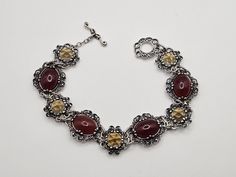 Designer Carolyn Pollack 925 Silver Carnelian and Citrine Bracelet Item w#2651 Clean and in good condition Marked 925  Hallmarked Relios, Carolyn Pollack 28.15 grams 19mm Wide 8.5 inches long Welcome to Westgate Jewels! At Westgate Jewels, we specialize in vintage estate jewelry, vintage designer jewelry, Vintage Native American jewelry and wears, Collectables, and Vintage fine karat gold and sterling silver jewelry. Our Collection Our shop features items in estate, antique, and vintage conditio Vintage Native American Jewelry, Citrine Bracelet, Vintage Designer Jewelry, Vintage Designer, American Jewelry, Native American Jewelry, Jewelry Vintage, Unique Charms, Designer Jewelry