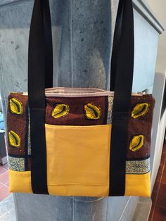 Stitched with attention to detail, this bag is made of two fabrics. The corn-yellow lower side is made of imitation leather, therefore very stable, the brown-coloured fabric is made of cotton and has been reinforced with fleece. On the front is a pocket, which can be closed with a Velcro. The lining is beige with a small pattern, also made of cotton fabric.  At the top is a beiger zipper sewn in. The straps are completely sewn around the bag and not only give the bag a great design but also make Brown On-the-go Shoulder Bag With Pockets, Brown Backpack Shoulder Bag With Pockets, Rectangular Brown Bags With Pockets, Brown Rectangular Bags With Pockets, Brown Shoulder Backpack Bag With Pockets, Brown Shoulder Bag With Zipper Pocket For School, Brown Double Handle Satchel For School, Fabric Shoulder Bag With Adjustable Strap, Brown Tote Shoulder Bag For School