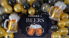 beer mugs and balloons are on display in front of a sign that says cheers and beers