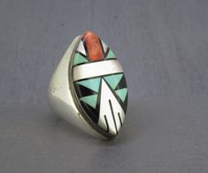 Vintage huge sterling silver zuni ring with turquoise, onyx, mother of pearl, and spiny oyster.  Great piece with only some light age related wear and patina.  Signed sterling. Visit Ribbons Edge for more great pieces of vintage and antique jewelry!  All items added to your cart at Ribbons Edge will automatically combine shipping. To stay up to date with my newest offerings, follow me on IG @ RibbonsEdge Zuni Jewelry Yourgreatfinds ♥ Vintage Jewelry, Silver Gift Wrap, Zuni Jewelry, Mens Rings Fashion, Southwestern Jewelry, Spiny Oyster, Silver Gifts, Men's Rings, Turquoise Jewelry