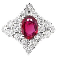 A beautiful ring set in 18 Karat Gold featuring a 1.01Carat Natural Ruby and 1.20 Carat Diamonds. Rubies are referred to as "Ratnaraj" in Sanskrit meaning the King of Gems. Early cultures treasured rubies for their similarity to the redness of the blood that flowed through their veins, and believed that rubies held the power of life. The ring is made in Japan. Ring size and stamping detailed below. Contact Us for more information. If required, we can adjust the ring size free of cost. Ring Size: