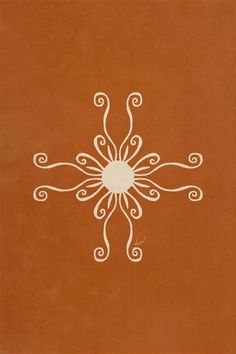 an orange book with white designs on it