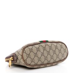 This is an authentic GUCCI GG Supreme Monogram Textured Calfskin Web Large Ophidia Cosmetic Case in Beige, Ebony, and New Acero. This stylish travel bag is crafted of GG monogram coated canvas with brown leather trim and green and red web stripe down the center. The top unzips to a brown nylon interior. Stylish Travel Bag, Red Web, Gg Monogram, Green And Red, Cosmetic Case, Leather Trim, Leather Trims, Travel Bag, Calf Skin