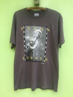 DONNA SUMMER 1999's  Pit To Pit:22Inches Length:31.7Inches Colour:Dark Grey  Material:100Cotton Double stitch Tag:TulTex Condition:1Small Hole all good 90s Tshirt, Donna Summer, Double Stitch, Bowling Shirts, Summer Tshirts, Summer Shirts, Jeans Shop, Vintage Clothing, Vintage Outfits