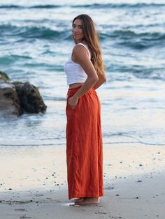 Our boho-chic Catalina Wide Leg Linen Pants are made of 100% linen for breathability and comfort for your next adventures. The wide-leg silhouette adds a touch of sophistication, while the side pockets provide convenient storage for your essentials. Designed with your comfort in mind, these pants feature a double-lined construction to ensure extra coverage and a flattering fit. The elastic ruffled waistband adds a playful touch, while the adjustable tie strings allow you to customize the look to Wide Leg Harem Pants With Pockets For Beach, Bohemian Linen Maxi Skirt For Beach, Vacation Wide-leg Linen Maxi Skirt, Linen Maxi Skirt For Summer Beach, Casual Linen Maxi Skirt For Beach, Bohemian Straight Leg Harem Pants For Beach, Wide Leg Harem Pants With Pockets For Vacation, Beach Linen Wide Leg Maxi Skirt, Linen Wide-leg Maxi Skirt For Beach