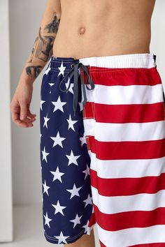 Beach Shorts With Flag Print, Shorts For 4th Of July Beach Events, Short Shorts For 4th Of July Beach Events, 4th Of July Beach Shorts, White Beach Bottoms For 4th Of July, White Bottoms For 4th Of July Beach Outing, Red Flag Print Shorts For Beach, American Flag Print Cotton Bottoms For Memorial Day, Red Flag Print Beach Shorts