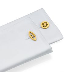 A .45 carat jet black diamond is set in one of these eye-inspired cufflinks while the other features precisely carved triangular cutouts for an asymmetrical pair. These matte 18K solid yellow gold cufflinks flaunt a minimalist and sleek look that adds uniqueness to your sleeve. Diamond Cufflinks, Double Heart Ring, Diamond Cufflink, Gold Luxury, Gold Cufflinks, Stackable Bracelets, Black Diamonds, Pinky Ring, Gold Design