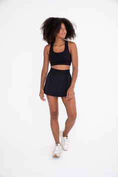 The perfect skirt for on and off the court! It features a seam that swoops all the way around, a thick elastic waistband, and built-in shorts with side pockets. Fabric & fit: 88% nylon 12% spandexMoisture-wickingFour-way stretch Model is wearing size Small. Hiking Leggings, Pole Shorts, Graphic Leggings, Tennis Skort, Bootcut Pants, Clothing Retail, High Rise Shorts, Short Leggings, Staple Pieces