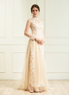 Custom made Champagne Ao Dai with white lace Collar: 1.8''/ 4.5cm Long sleeves Zipper closure Chiffon pants Sweep train (12''/30cm) Beadings: yes Materials: chiffon, tulle, lace Made to measure