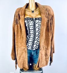 This vintage fringe leather jacket is brown in color, and has suede leather trimming the sleeves and the back of the jacket. It is fully lined and has a front button closure.  It is in excellent condition with no holes or stains that I can see. The marked brand is "Comint" and the marked size is Medium.. This would best fit a size Medium/Large. Please measure yourself before buying if you plan on wearing it. (All measurements are taken with the garment lying flat and then doubled.) MEASUREMENTS: Leather Jacket Mens, Vintage Fringe, Fringe Leather Jacket, Leather Jacket Men, Brown Suede, Leather Trims, Suede Leather, Mens Jackets, Adult Outfits