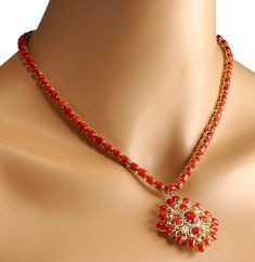 Stamped: 14K Yellow GoldTotal Necklace Weight: 30.0 GramsNecklace Length: 17 InchesNecklace Width: N/AGemstone Weight: Total Natural Center Coral Weight is 1.35 Carat (Measures: 9.15x7.08 mm)Color: RedGemstone Weight: Total Natural Side Coral Weight is 50.56 CaratColor: RedDiamond Weight: Total Natural Diamond Weight is 1.10 CaratColor: F-G, Clarity: VS2-SI1Face Measures: 43.96x42.28 mmSku: [702601W] Coral Pendant Indian Gold, Coral Jewelry Indian Gold, Coral Jewelry Necklace, Coral Jewelry Vintage, Coral Jewellery, Red Coral Jewellery, Coral Jewelry Set, Red Coral Necklace, Coral Beads Necklace