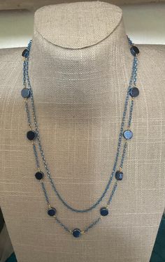 Two strand necklace in blue and gold. One strand is just chain the second has blue pyrite coins. Elegant Blue Chain Necklace For Party, Elegant Blue Long Chain Necklace, Elegant Long Blue Chain Necklace, Elegant Blue Beaded Chain Necklace, Elegant Blue Chain Jewelry, Elegant Blue Jewelry Chain, Elegant Blue Beaded Necklaces With Chain, Blue Round Chain Necklace, Elegant Blue Necklace With Gold Chain