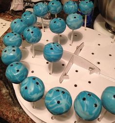 blue cake pops are arranged in the shape of a heart