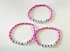 Barbie pink seed bead bracelet Adjustable Pink Name Bracelet With Colorful Beads, Adjustable Pink Bracelets With Letter Beads, Pink Beaded Bracelets With Spacer Beads As Gift, Pink Name Bracelet With Colorful Beads For Friendship, Pink Name Bracelet With Letter Beads, Pink Adjustable Name Bracelet With Round Beads, Pink Beaded Name Bracelet For Gift, Pink Friendship Bracelets With Spacer Beads, Pink Beaded Name Bracelet As Gift