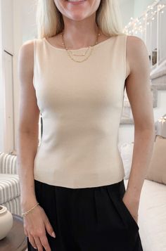 The Penelope Boat Neck Top in Tan has a classic silhouette that can easily be dressed up or down! The timeless boat neckline on this blouse truly sets it apart. Featuring a knit fabric, tan color, boat neckline and a true to size fit. Style this sleeveless top with a nice pair of trousers or jean shorts! Details & Sizing Knit fabric Tan color Boat neckline True to size fit Gabriella is wearing a size S Fabric 40% Acrylic 32% Rayon 28% Polyester Shipping & Returns We offer free ground shipping on Elegant Fitted Sleeveless Knit Top, Elegant Seamless Stretch Tops, Chic Solid Stretch Knit Top, Chic Stretch Solid Color Knit Top, Elegant Fitted Seamless Top, Fitted Fine Knit Cream Top, Elegant Stretch Knit Top With Crew Neck, Beige Stretch Top With Scoop Neck, Chic Fitted Beige Top