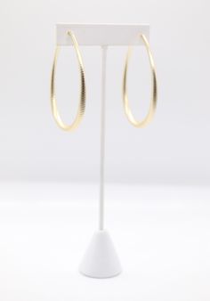 Matte gold teardrop earrings feature a sleek and smooth finish with a subtle sheen, providing a sophisticated yet understated elegance. Their teardrop shape offers a classic and timeless design, making them versatile for both casual and formal occasions. Chic Oval Earrings For Formal Occasions, Classic Drop Hoop Earrings For Formal Occasions, Chic Gold Teardrop Hoop Earrings, Formal Teardrop Hoop Earrings, Minimalist Gold Teardrop Earrings, Minimalist Gold Teardrop Pendant Earrings, Classic Teardrop Hoop Earrings For Formal Occasions, Elegant Yellow Gold Pear-shaped Hoop Earrings, Elegant Pear-shaped Yellow Gold Hoop Earrings