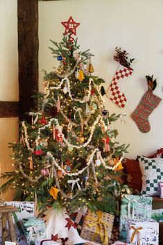 a decorated christmas tree with presents under it