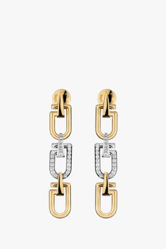 The Long Reine earrings are designed with three minimal, curved links resembling a snap hook in its most simplified form. This pair has been crafted in Italy from 18-karat yellow and white gold, with the central link set with pavé diamonds. Composition: 18-karat yellow & white gold (25g) G SI diamonds, 0.567 carats Diamonds provided by an RJC member Made in Italy Size & Fit Length: 51mm Width: 10mm Pre-Order Please expect a 3-week waiting period. Thank you for your patience. Care Always remove y Yellow Gold Diamond Earrings, Gold Jewelry Stores, Gold Diamond Earrings, Diamonds And Gold, Jewelry Photography, Engraved Logo, Fine Jewellery Earrings, Gold Jewelry Fashion, Pave Diamonds