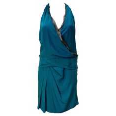 Gucci Teal Halter Cocktail Dress - with many different options to style it! Inner black gold inlay on the neck and detailed tassels with attached scarf. Scarf can hang in the back or the front or wrap around the neck (see attached photos). 100% silk Tags attached never worn !! Retails for $2,835 Size 40 (but a small 40) Model is a size US 2 and it also fits fine Length 39" Made out of