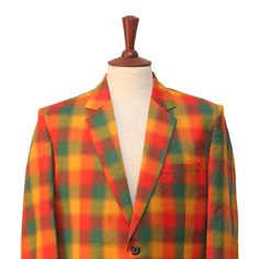 This Chiragh Apparel blazer is an elegant upgrade on dapper tailoring and features rich shades in a sumptuous fabric for elegant opulence. Fashioned from premium quality wool, this plaid check blazer features full lining in Japanese silk, a notch lapel, two-button closure and single-vented back. A left chest pocket and three flap pockets appoint the front while the inside has two (2) pockets on the left and one (1) pocket on the right. A flash of contrast piping is added to the jacket lining ins Elegant Multicolor Blazer With Notch Lapel, Multicolor Notch Lapel Blazer For Fall, Elegant Multicolor Formal Blazer, Multicolor Notch Lapel Blazer For Formal Occasions, Tailored Multicolor Blazer For Fall, Multicolor Fitted Suits For Formal Occasions, Multicolor Fitted Formal Suits, Elegant Multicolor Formal Outerwear, Multicolor Fitted Notch Lapel Blazer