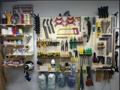 the wall is full of tools and supplies