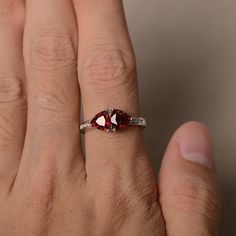 This is a gorgeous handmade creation. Its beauty is its simplicity & Elegance. The 6*6mm trillion garnet is crafted in solid sterling silver and with rhodium plated. It's made to order and it will take about 7 days to make it. All item is sent in a beautiful gift box You can realize more lovely stuff clicking the link https://www.etsy.com/shop/knightjewelry?refshopsection_shophome_leftnav Please leave the correct address and you phone number for delivering successfully. Red Gemstone Ring, January Birthstone Rings, Alexandrite Ring, Promise Rings For Her, Red Gemstones, Garnet Rings, Birthstone Ring, Beautiful Gift Boxes, Black Rings