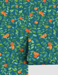 an orange and green floral pattern on blue background