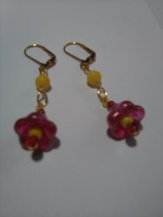 "Ringing in Autumn earrings with the look of a red bell flower of frosted glass, with a yellow and red shimmer bead dangling in the middle, like a stamen. Hanging about 2.5\" long on gold-plated lever backs, accented by a yellow round glass bead. All larger Czech glass beads connected by GP chain links. So pretty in the light of Autumn and with the new clothes colors." Handmade Gold Flower Earrings With Czech Glass, Gold Czech Glass Flower Earrings For Gift, Nickel-free Gold Czech Glass Flower Earrings, Gold Czech Glass Dangle Flower Earrings, Gold Nickel-free Czech Glass Flower Earrings, Nickel-free Gold Flower Earrings With Czech Glass, Gold Flower-shaped Czech Glass Earrings, Gold Flower-shaped Earrings With Czech Glass, Gold Dangle Flower Earrings With Czech Glass