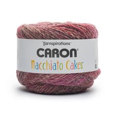 yarn that is pink and purple with the words caron machchato cakes on it