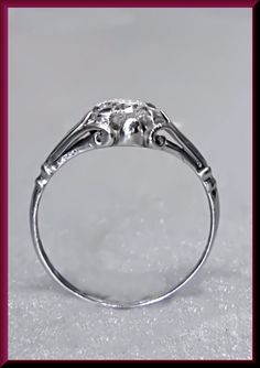 a white gold ring with diamonds on it