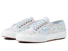 Superga 2750 - Floral Print - Women's Shoes : Light Blue Floral : Lace up these pretty canvas sneakers and pair them with your favorite casual summer outfit for a fun and flirty fashionable look by Superga. Cushioned footbed provides sustained comfort for all-day wear. Round toe silhouette. Allover floral print design. Lace-up closure with metal eyelets for an adjustable fit. 1 vulcanized midsole. Canvas upper. Fabric lining. Natural rubber, crepe-textured outsole offers traction and durability. Casual Low-top Floral Print Sneakers, Trendy Floral Print Sneakers For Spring, Spring Floral Print Sneakers With Round Toe, Floral Print Round Toe Sneakers For Spring, Spring Floral Print Round Toe Sneakers, Comfortable Floral Print Sneakers For Spring, Casual Lace-up Sneakers With Floral Print, Casual Floral Print Lace-up Sneakers, Floral Print Sneakers For Spring Streetwear