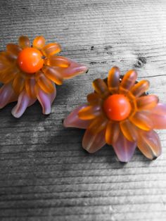 These one of a kind vintage earrings are extraordinarily beautiful. Silver tone clip on shows wear due to age, but well intact. The color scheme is lustrous and stunning. Vintage Handmade Clip-on Earrings For Party, Vintage Orange Beaded Earrings, Handmade Vintage Clip-on Earrings For Party, Orange Beaded Vintage Earrings, Vintage Clip-on Flower Earrings, Vintage Flower Earrings For Formal Occasions, Vintage Orange Flower Jewelry, Orange Vintage Flower Jewelry, Elegant Orange Clip-on Earrings