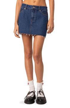 This cute miniskirt is made with nonstretch denim and designed with a raw hem for authentic vibes. Zip fly with button closure Coin pockets; front slant pockets; back patch pockets 100% cotton Machine wash, line dry Imported Trendy Mid-rise Denim Skirt With Frayed Hem, Cotton Denim Blue Skort With Frayed Hem, Denim Blue Cotton Skort With Frayed Hem, Summer Mid-rise Skirt With Frayed Hem, Summer Stretch Skirt With Frayed Hem, Stretch Summer Skirt With Frayed Hem, Stretch Skirt With Frayed Hem For Summer, Mid-rise Stretch Cotton Mini Skirt, Stretch Cotton Mid-rise Mini Skirt